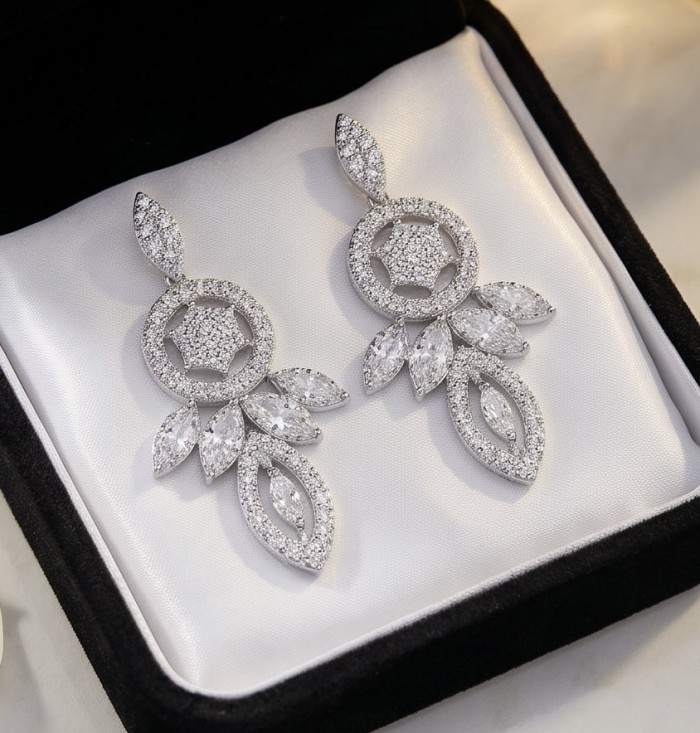 Waves 0.6 carat authentic White Topaz .925 Sterling Silver Handcrafted Earrings - Earrings in box, top view, featuring white topaz and sterling silver design.