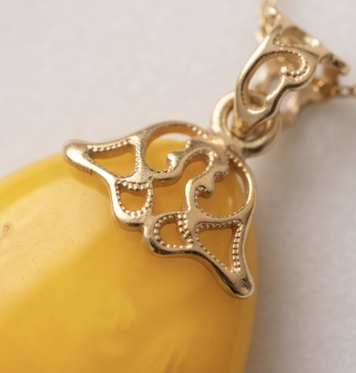 Prehistoric Authentic Baltic Amber REAL 14k Gold beautifully handcrafted Pendant - Close-up of Baltic amber pendant with intricate 14k gold detailing.