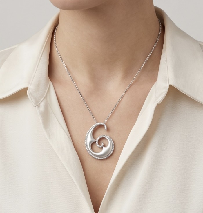 Waves 0.5 carat authentic White Topaz .925 Sterling Silver Handcrafted Pendant - Necklace with spiral pendant worn on a cream blouse