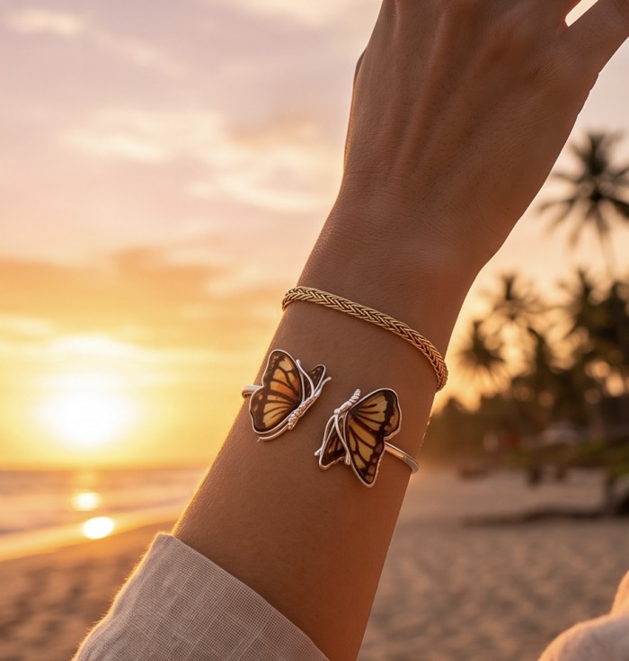 Golden Butterfly Genuine carved Baltic Amber .925 Sterling Silver dipped in rhodium handamde Bracelet - Hand wearing golden butterfly bracelets at sunset beach
