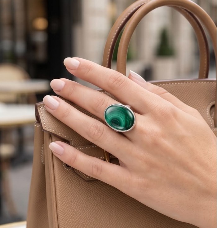 Green Aura 33.2 CARAT genuine Malachite from Utah .925 Sterling Silver handcrafted ring size 8 adjustable - Hand wearing Green Aura 33.2 carat malachite ring, holding a tan bag.