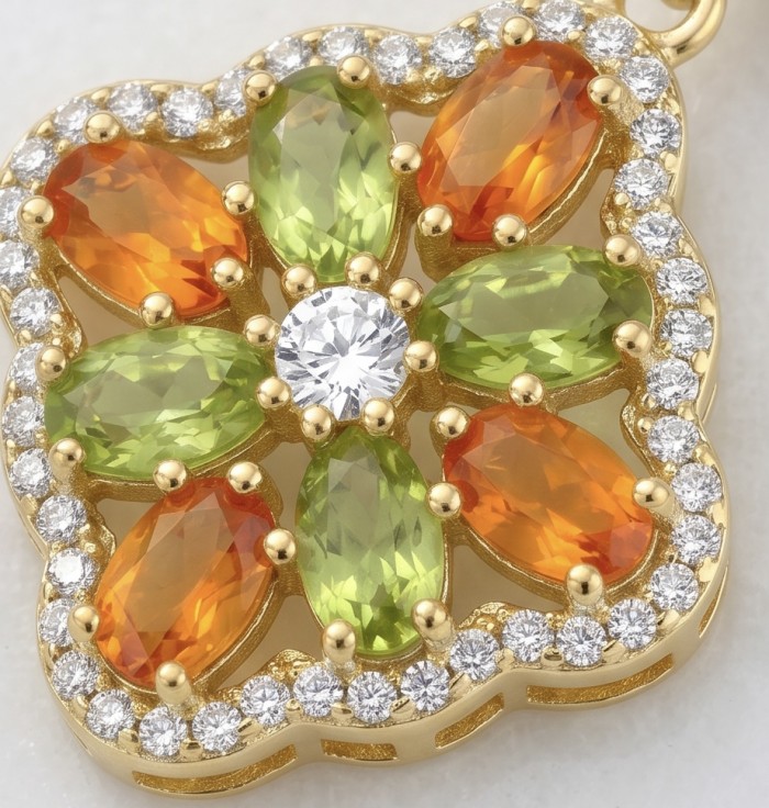 Giovanna - Genuine 4.6 carat orange Sapphire 22K Gold over .925 Sterling Silver handcrafted Statement Earrings - Close-up of Giovanna pendant, orange sapphires, and green stones in gold.