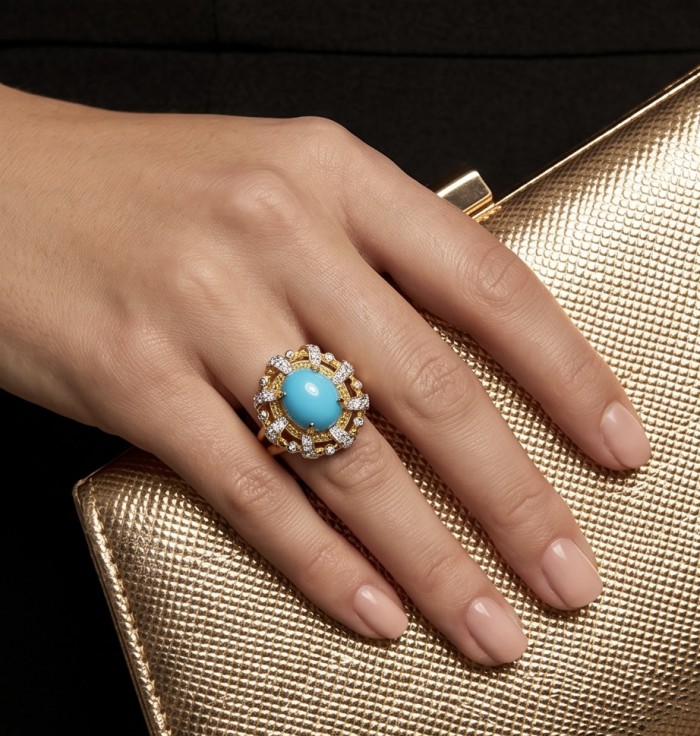 Sofia - authentic Sleeping Beauty Turquoise 22K Gold over .925 Sterling Silver handcrafted Statement Ring size 6 - Turquoise ring worn on hand, gold mesh clutch in background.