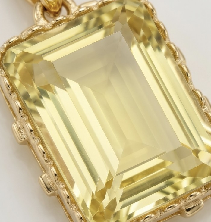 Emerald cut 10.3 carat Lemon Quartz 18K Gold over .925 Sterling Silver handcrafted pendant - Stone close-up of emerald cut 10.3 carat lemon quartz pendant in gold.