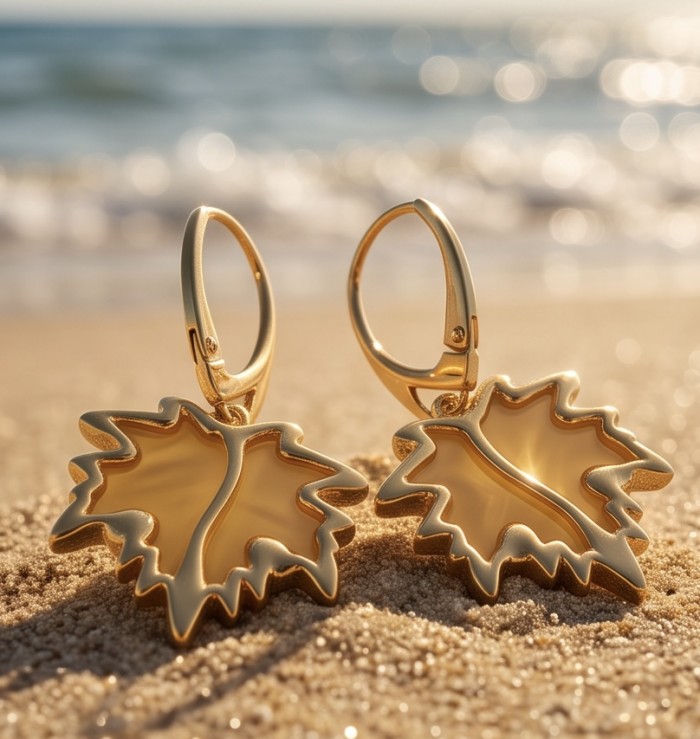 Golden Leaves Genuine carved Butterscotch Baltic Amber 18K Gold over .925 Sterling Silver handcrafted Earrings - Golden leaf earrings on sandy beach, sunlit background.
