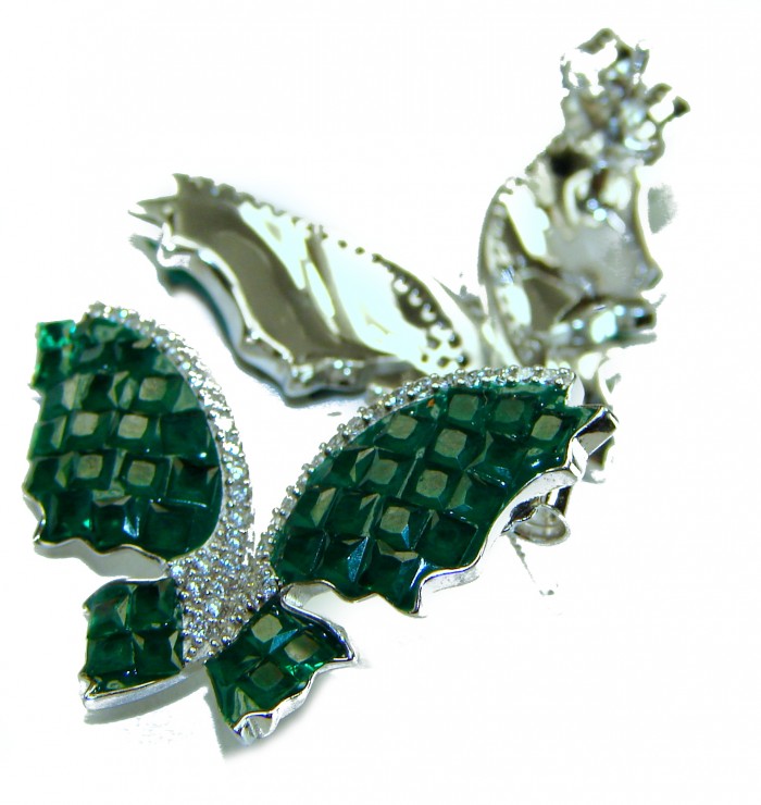 Incredible green Butterflies genuine 10.5 CARAT Emerald .925 Sterling Silver handcrafted Earrings - Close-up of green butterfly brooch with emerald detailing.