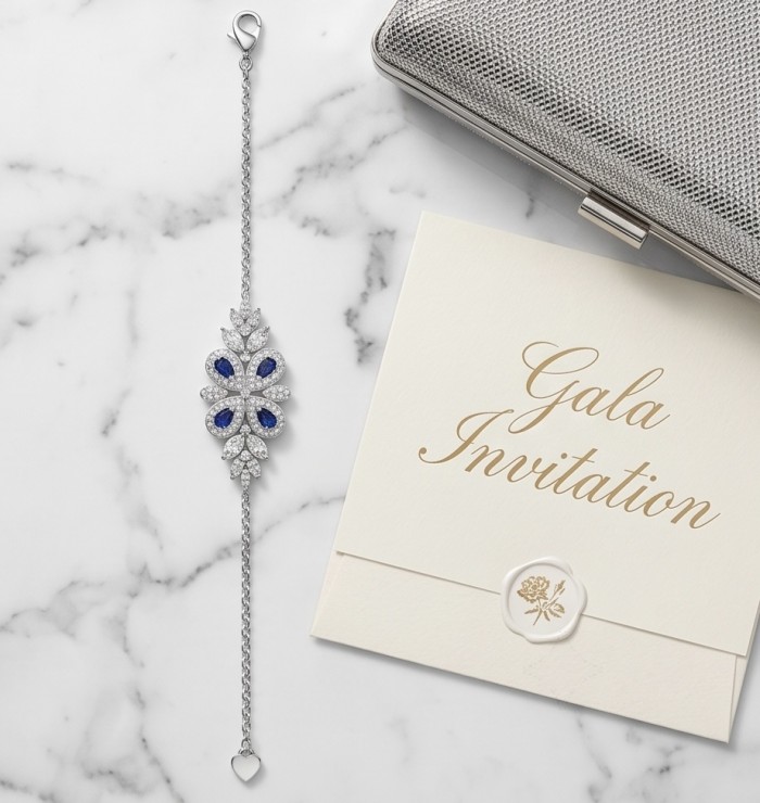 Precious Art deco Genuine 0.7 carat Sapphire .925 Sterling Silver handcrafted Bracelet - Art deco bracelet with sapphire on marble beside gala invitation, top view.