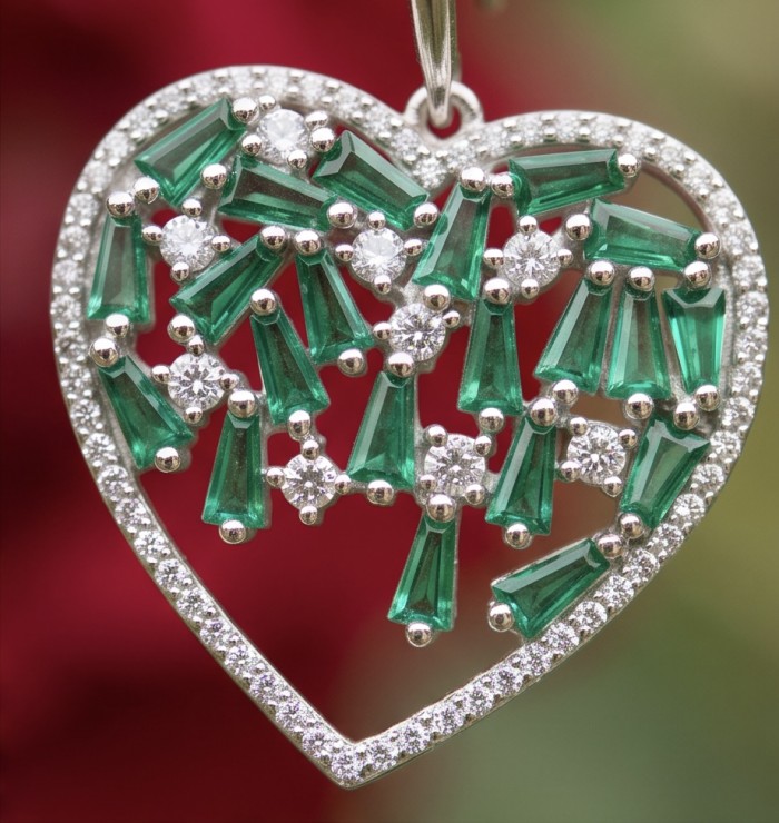 Hearts Wonderful natural Tsavorite Gasrnet rhodium over .925 Sterling Silver entirely handcrafted earrings - Heart-shaped pendant with emerald and diamond stones, close-up view.