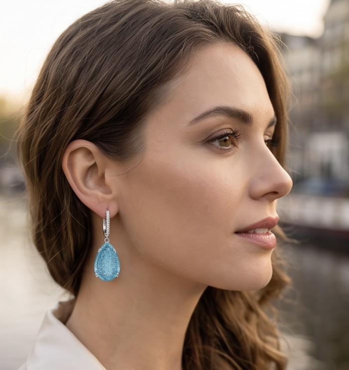 Angelina 20.9 carat authentic Aquamarine .925 Sterling Silver Handcrafted Earrings - Side view of aquamarine earrings worn by a woman.