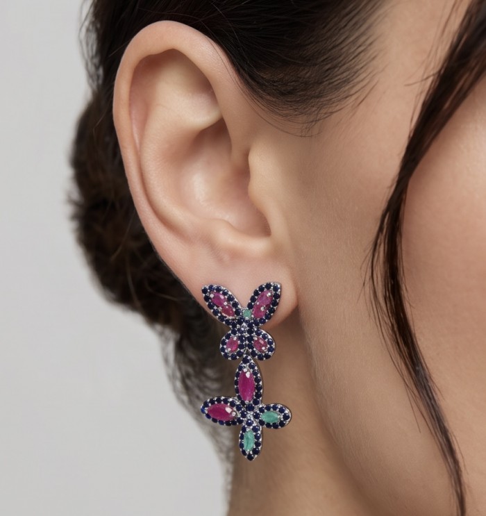 RARE BEAUTY! Valentina 28.2 carat Ruby Emerald Sapphire .925 Sterling Silver dipped in rhodium Statement handcrafted earrings - Earrings with ruby, emerald, and sapphire worn on ear, side view.
