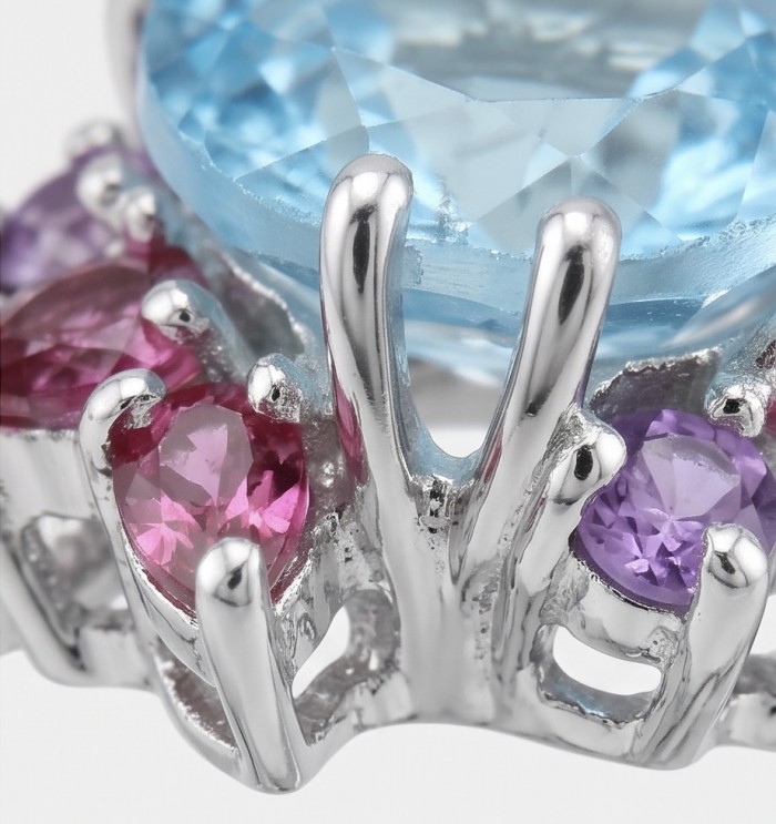 Pacifica 4.8 carat Swiss Blue Topaz .925 Sterling Silver handcrafted ring size 9 - Close-up of Swiss Blue Topaz ring with pink and purple gemstones.