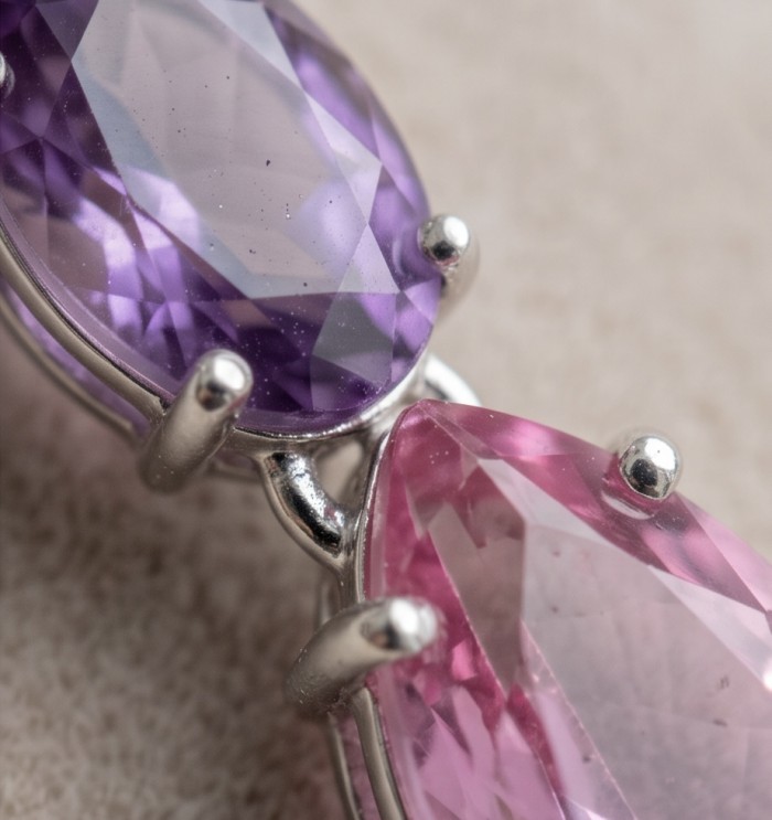 Tiffany - authentic marquise cut 12.7 carat Pink Sapphire .925 Sterling Silver handcrafted Earrings - Close-up of marquise-cut purple and pink gemstones in silver setting