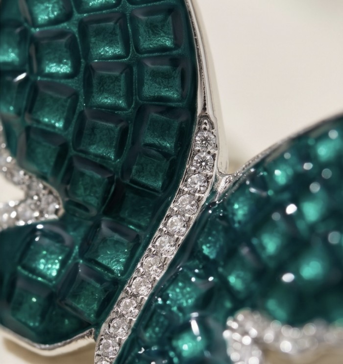 Incredible Butterflies genuine mystery setting 15.5 CARAT Emerald .925 Sterling Silver handcrafted Earrings - Close-up of exquisite butterfly design with gemstones and detail.