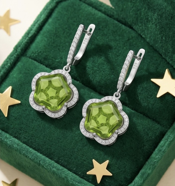 Green Clover 10.9 carat authentic Brazilian Peridot .925 Sterling Silver Handcrafted Statement Earrings - Green clover peridot earrings on green background, front view close-up.