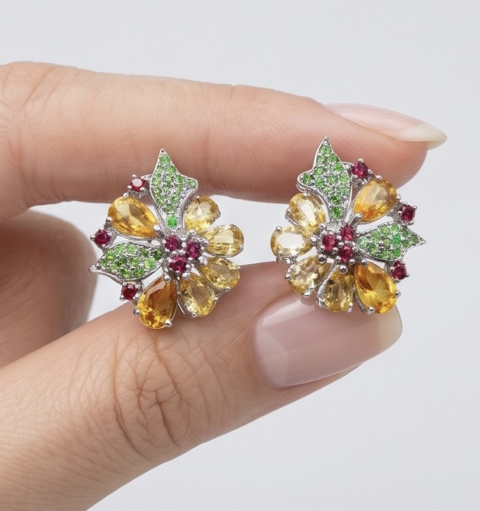 Vivien Luxurious Style - Natural 19.2 carat Brazilian Citrine .925 Sterling Silver dipped in rhodium handmade earrings - Close-up of vibrant floral earrings held between fingers