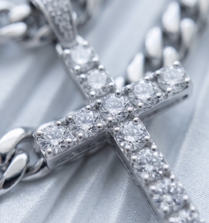 Precious White Cross Genuine 14K White Gold over .925 Sterling Silver handmade necklace - Close-up of a diamond-studded white gold cross pendant on a chain.