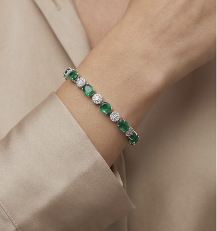 Art Deco 6.7 carat Emerald .925 Sterling Silver handcrafted Bracelet - Emerald bracelet on wrist, showcasing stones and design details.