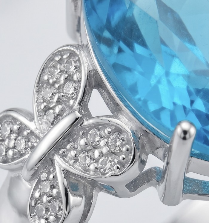 Paris Sky Blue 14.8 carat Swiss Blue Topaz .925 Sterling Silver dipped in rhodium handcrafted ring size 7 3/4 - Close-up of butterfly detail on Swiss Blue Topaz sterling silver ring