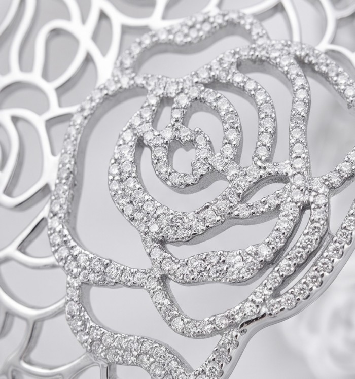 Dolce Vita - Precious Natural 12.5 carat pave White Topaz rhodium over .925 Sterling Silver handcrafted bracelet - Close-up of Dolce Vita White Topaz pave jewelry, intricate rose design.
