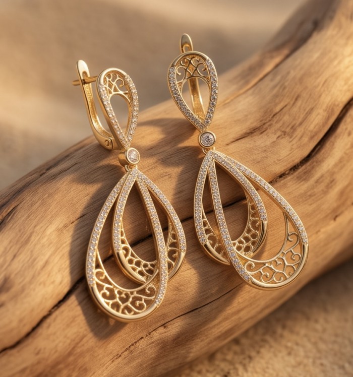 Black Label Collection - Dubai Style - Natural 22K Gold over .925 Sterling Silver handmade earrings - Elegant gold earrings with intricate design on a wooden background