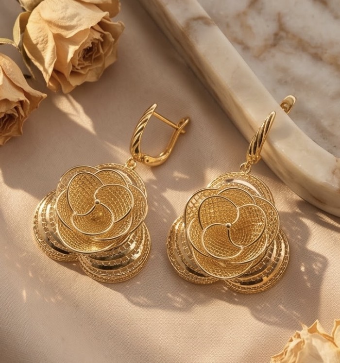 Golden Roses Dubai Style - .925 Sterling Silver dipped in 22K Gold handmade Earrings - Golden rose earrings on fabric background, top view