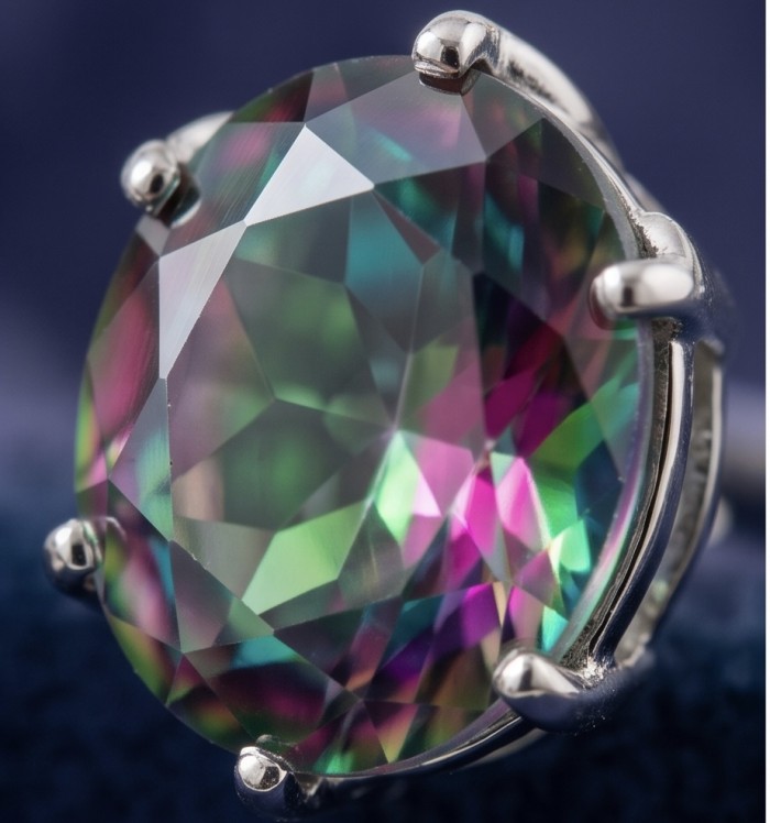 Luxurious authentic 11.2 carat Brazilian Tourmaline .925 Sterling Silver handcrafted earrings - Close-up of Brazilian Tourmaline gemstone in silver setting.