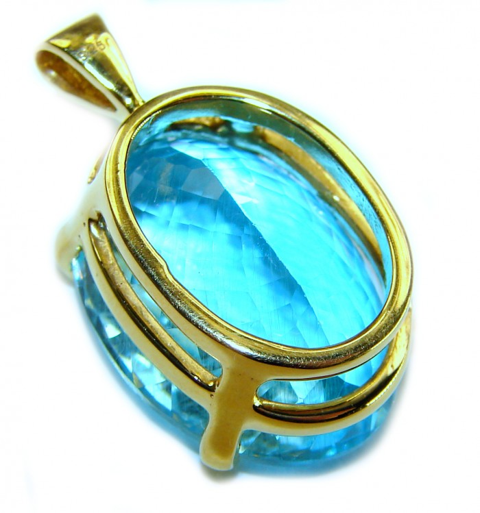Atlantica oval cut 25.9 carat Swiss Blue Topaz 18K Gold over .925 Sterling Silver Handcrafted Pendant - Side view of Atlantica 25.9ct Swiss Blue Topaz in 18K gold pendant
