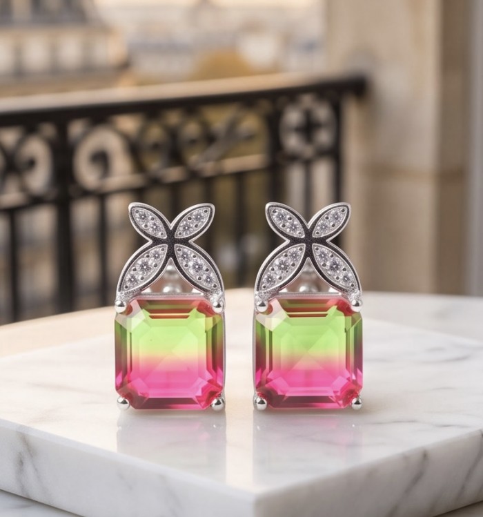 Luxurious authentic 10.2 carat Brazilian Tourmaline .925 Sterling Silver handcrafted earrings - Close-up of luxurious 10.2 carat Brazilian Tourmaline earrings on marble.