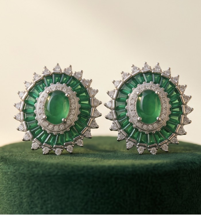 Art deco - Natural 2.8 carat Colombian Emerald .925 Sterling Silver Handcrafted Earrings - Close-up of art deco Colombian emerald earrings on green surface