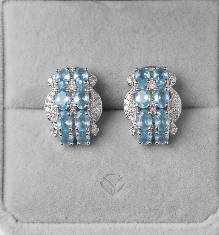 Angelina 9.9 carat authentic Swiss Blue Topaz .925 Sterling Silver Handcrafted Earrings - Pair of Swiss Blue Topaz earrings on display, front view.