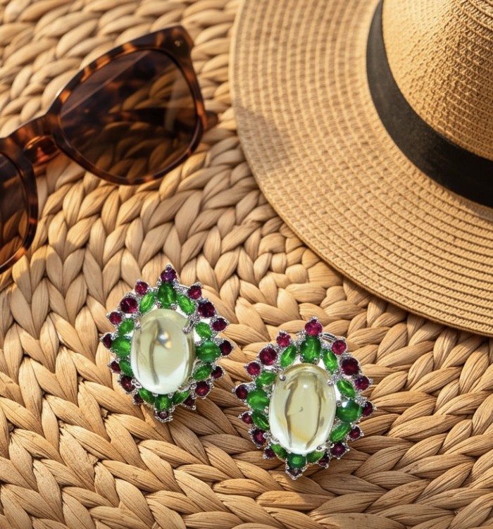 Bringer of Joy Authentic 29.9 carat Brazilian Citrine rhodium over .925 Sterling Silver brilliantly handcrafted Statement earrings - Jewelry with citrine stones on woven mat, sunglasses, and hat.