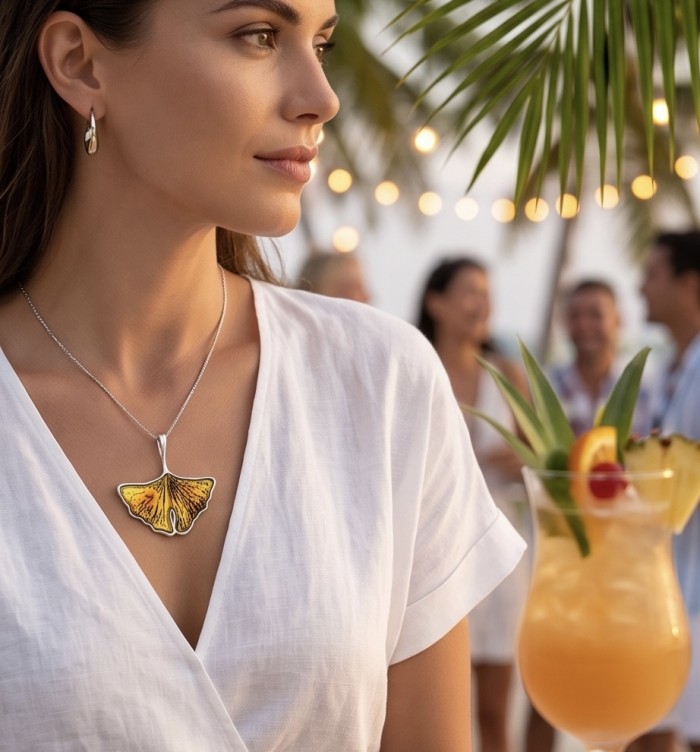 Calla Lily Prehistoric Authentic Butterscotch Baltic Amber .925 Sterling Silver beautifully handcrafted Pendant - Side view of woman wearing Calla Lily Amber necklace at a tropical party.