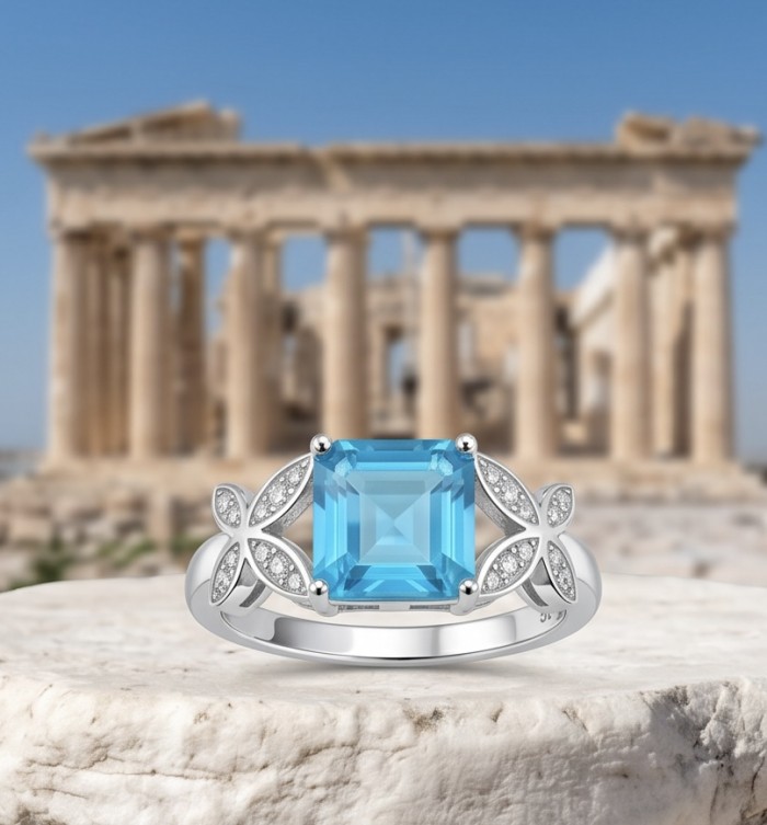 Stella 4.3 carat Swiss Blue Topaz .925 Sterling Silver dipped in rhodium handcrafted ring size 7 1/4 - Sterling silver ring with blue topaz, ancient Greek temple background.
