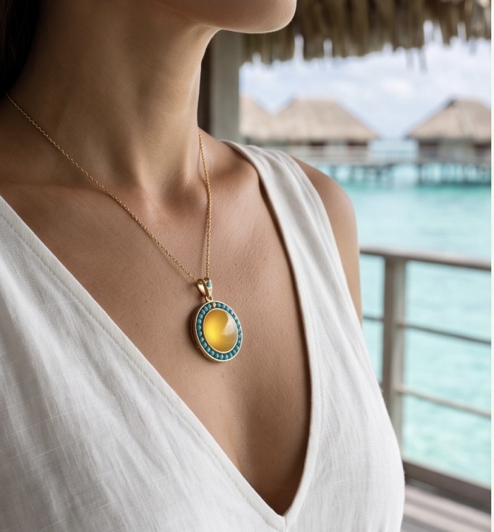 Golden Sun Prehistoric Authentic Butterscotch Baltic Amber .925 Sterling Silver beautifully handcrafted Pendant - Necklace with amber pendant worn at the beach, close-up view.