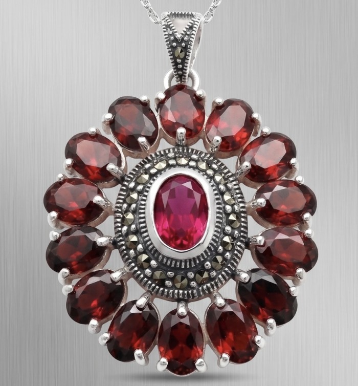 Giovanna 22.2 carat authentic Mozambique Ruby Marcasite .925 Sterling Silver handmade Pendant - Close-up of a ruby and marcasite pendant on a silver chain