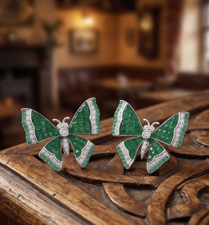 Incredible green Butterflies genuine mystery setting 11.5 CARAT Emerald .925 Sterling Silver handcrafted Earrings - Green butterfly jewelry in mystery setting displayed on carved wood.