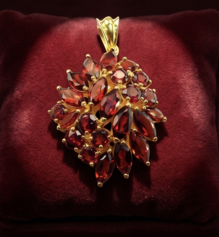 Marvelous Natural 20.8 carat Mozambique Garnet 22K Gold over .925 Sterling Silver Handcrafted pendant - Close-up of garnet pendant in 22K gold setting on velvet background.