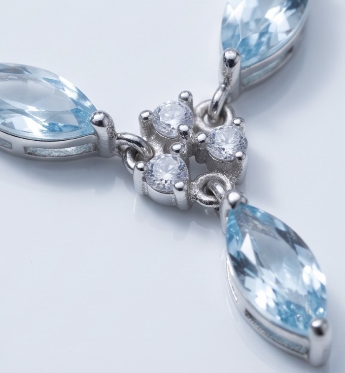 Infinity 9.5 carat Authentic Swiss Blue Topaz Rhodium over .925 Sterling Silver handcrafted Statement necklace - Close-up of Swiss Blue Topaz pendant with diamond accents