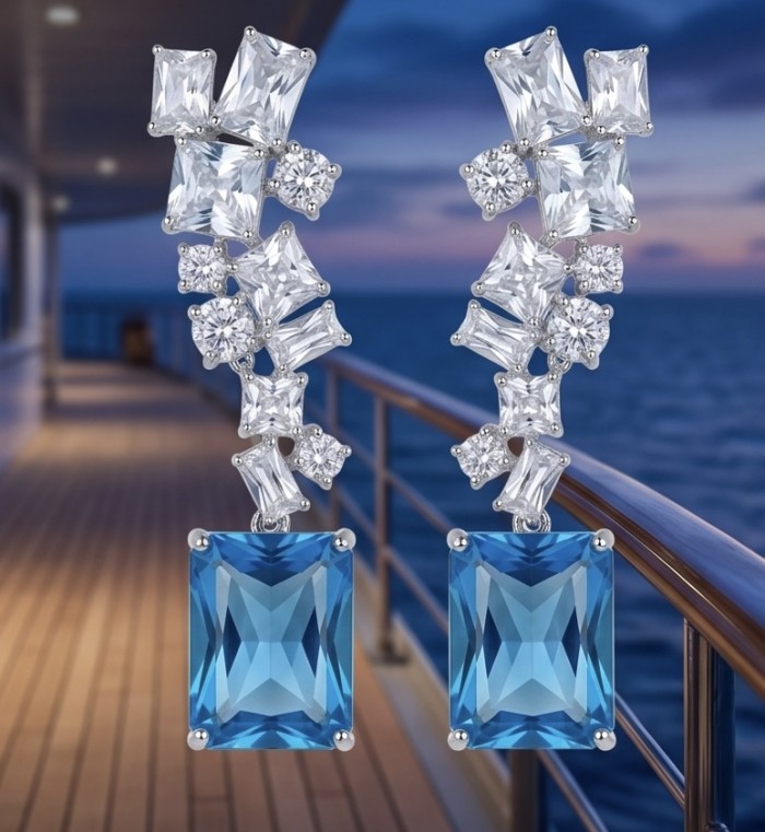 FINE Art 15.8 carat Swiss Blue Topaz rhodium over .925 Sterling Silver Handcrafted Statement earrings - Jewelry photo of Swiss Blue Topaz dangle earrings on a ship deck.