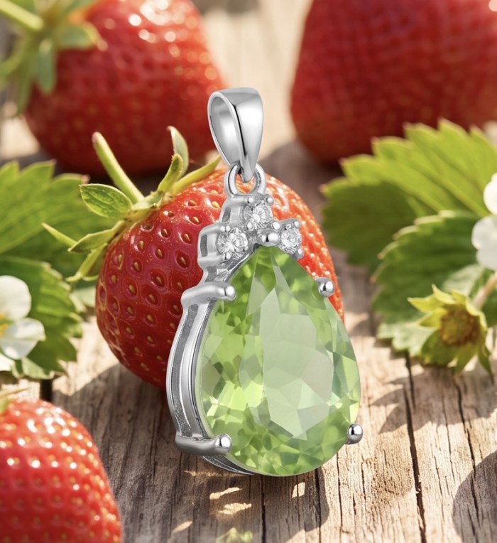 Rare - 8.5 carat Yellow-Green Tourmaline .925 Sterling Silver handmade Pendant - Close-up of yellow-green tourmaline pendant on strawberries background.
