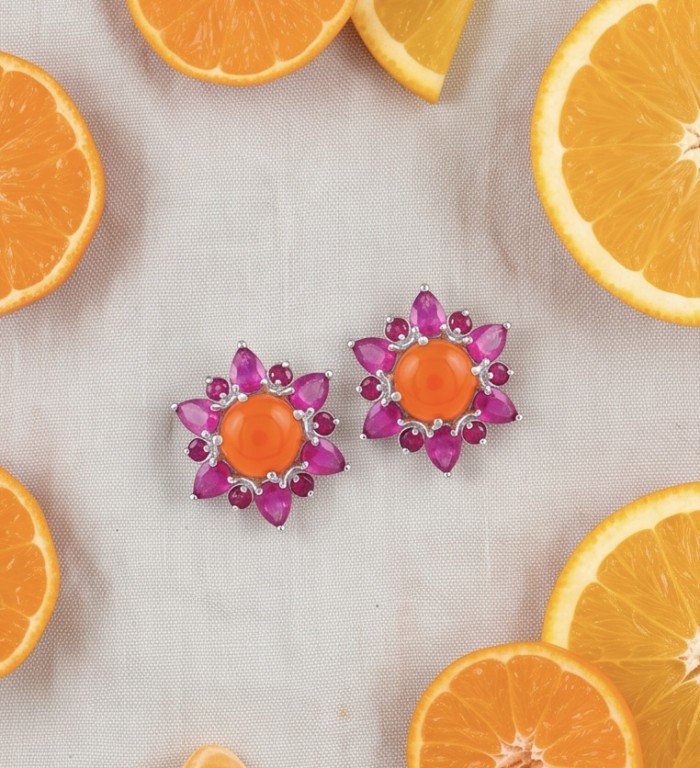 Beauty of nature Sublime Orange Carnelian RHODIUM OVER .925 Sterling Silver handmade earrings - Top view of floral earrings with orange stones and purple accents.