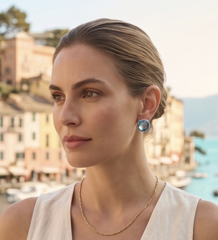 Stella 10.8 carat authentic Swiss Blue Topaz .925 Sterling Silver handmade Earrings - Woman wearing Swiss Blue Topaz earrings, side view, with gold necklace.