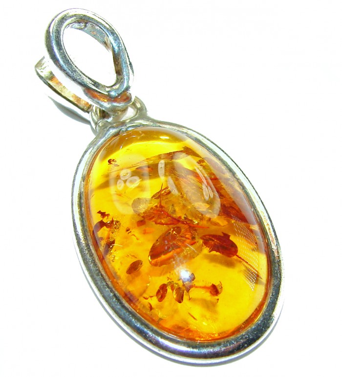 Prehistoric Authentic Baltic Amber .925 Sterling Silver handcrafted Pendant - Close-up of Baltic amber pendant with sterling silver setting.