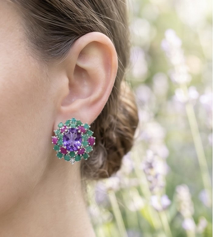 Francesca Genuine 8.9 carat Brazilian Amethyst rhodium over .925 Sterling Silver handcrafted Statement handcrafted earrings - Amethyst earrings close-up, worn on ear with floral background.