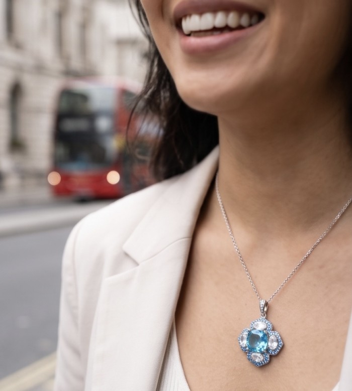 Stella 8.3 carat Swiss Blue Topaz .925 Sterling Silver dipped in rhodium handcrafted Pendant - Necklace close-up with Stella 8.3ct Blue Topaz pendant worn on neck