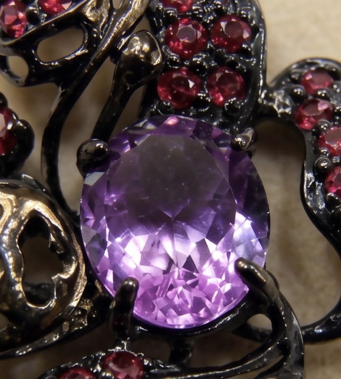 Beautiful Mystery 8.8 carat Precious Amethyst .925 Sterling Silver dipped in black rhodium handcarfted Pendant - Close-up of amethyst and red gems in sterling silver setting.
