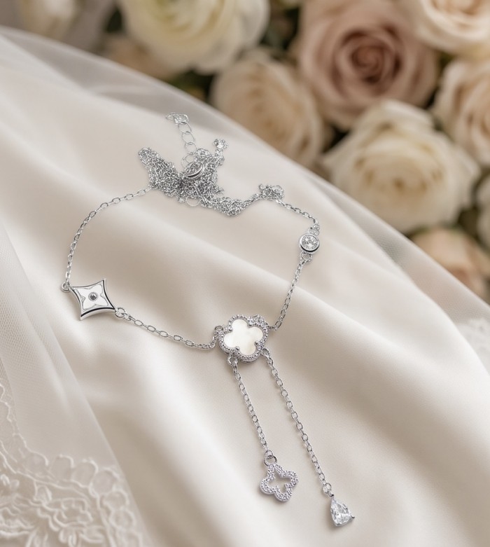 Outstanding Rainbow Blister Paerl Lucky Four Leaf Clover .925 Sterling Silver necklace - Elegant necklace with four-leaf clover detail on soft fabric background.