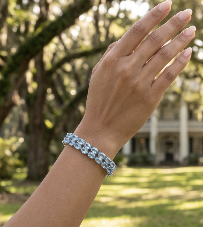 Serenity 88.9 carat genuine Swiss Blue Topaz .925 Sterling Silver handmade Large Statement Bracelet - Serenity Swiss Blue Topaz bracelet worn on hand, garden background.