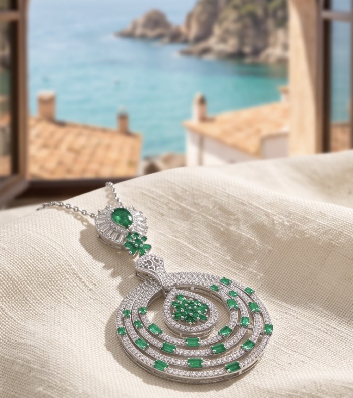 Precious 7.2 carat natural Colombian Emerald rhodium over .925 Sterling Silver .925 Sterling Silver Statement Necklace - Close-up of Colombian emerald necklace with oceanview background