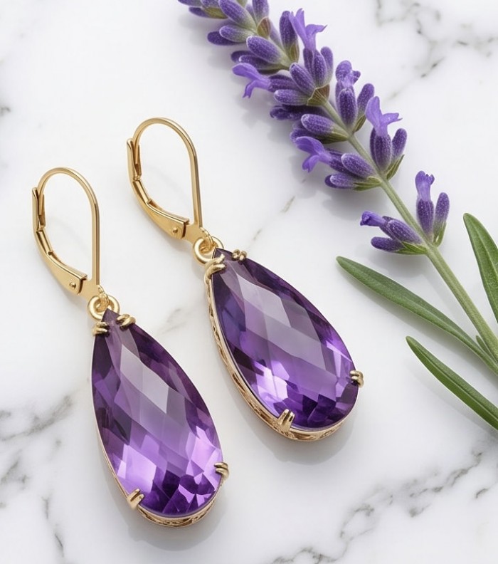 Natural 22.6 carat fancy pear cut Amethyst 14K Gold over .925 Sterling Silver handmade earrings - Amethyst earrings with gold leverbacks on marble, side view with lavender.